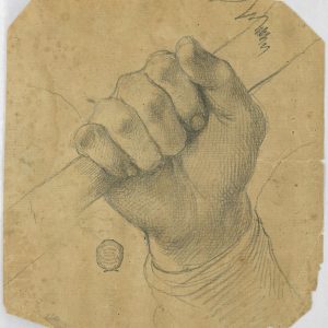 A man's hand holding a stick