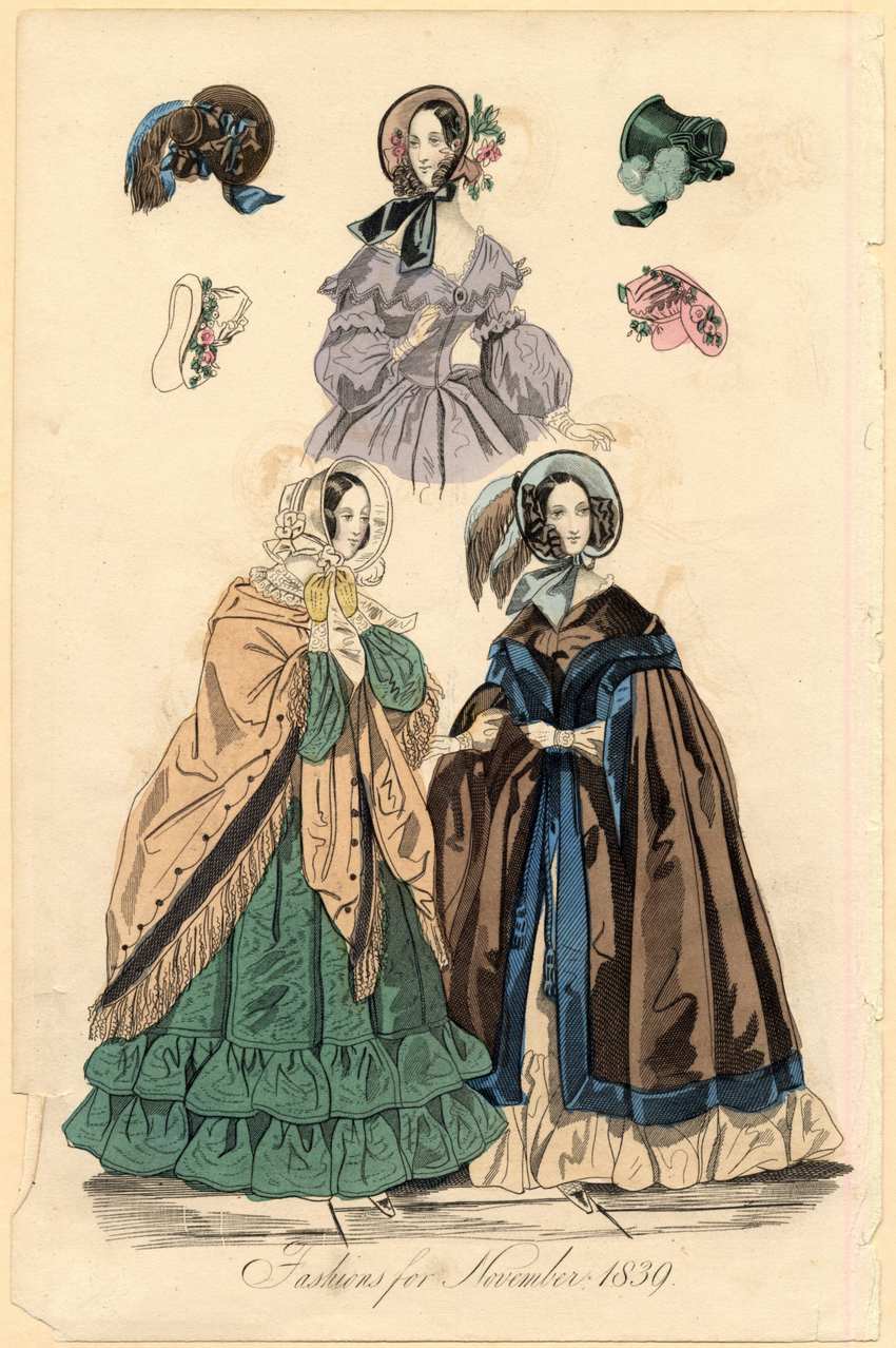 Victorian Fashion Plate November 1839: Women's Winter Mantles and Velvet Bonnets 1839 fashion plate showing women in winter wraps and mantles, featuring a green tiered skirt, brown velvet cloak, and feathered bonnets.