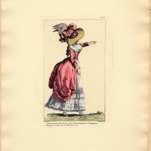 1787 fashion plate showing a woman in a red English redingote and straw hat with feathers walking in the Jardin du Roi, Paris.