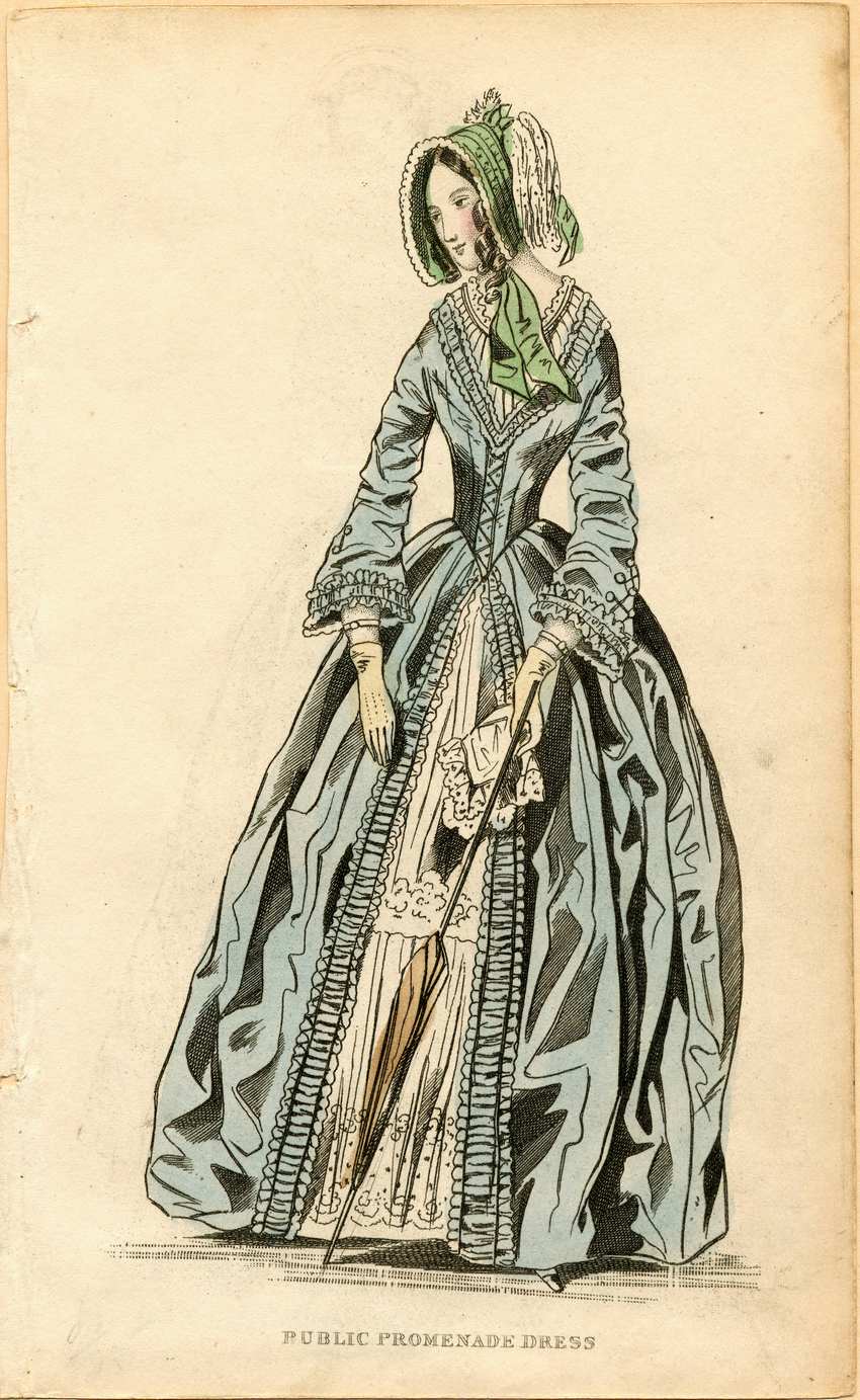 Early Victorian Slate Blue Public Promenade Dress with Embroidered Underskirt and Parasol Fashion Plate Victorian fashion plate of a woman in a blue promenade dress, green bonnet, and white ruffles holding a parasol.