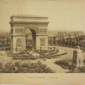 WWI Paris Victory Parade featuring French troops marching past the Arc de Triomphe and cenotaph monument on July 14, 1919.