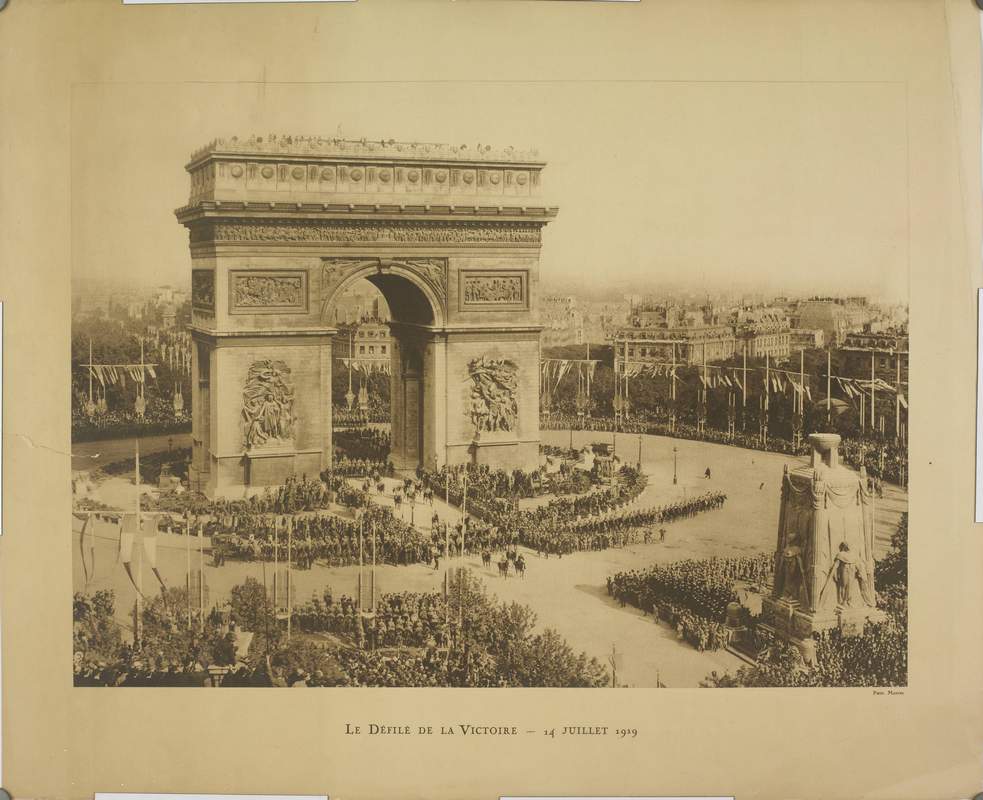 Paris World War I Victory Parade 1919 at Arc de Triomphe WWI Paris Victory Parade featuring French troops marching past the Arc de Triomphe and cenotaph monument on July 14, 1919.